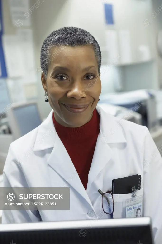 Middle-aged African female doctor smiling