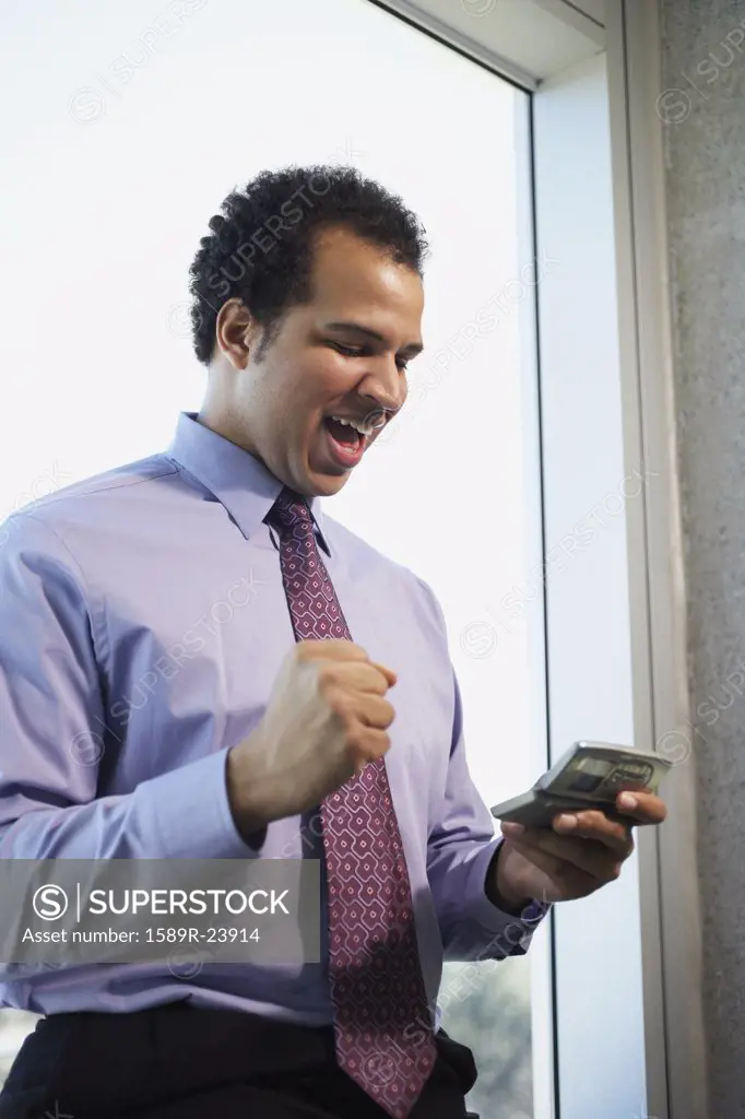 African American businessman using cell phone