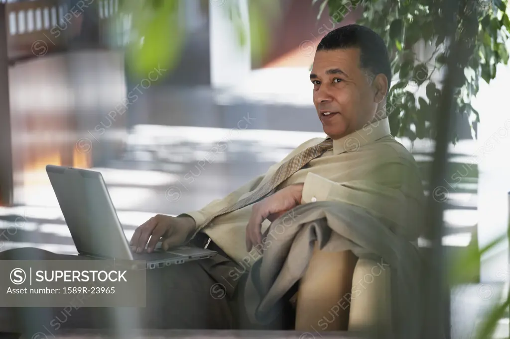 African American businessman with laptop