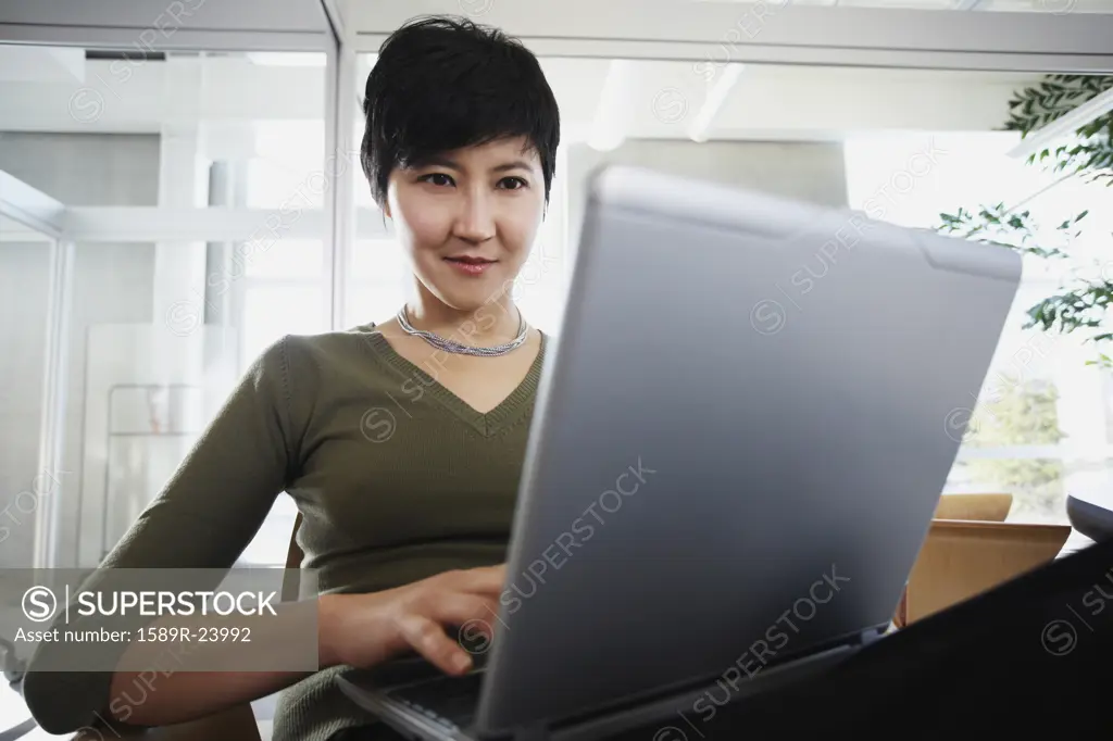 Asian businesswoman with laptop