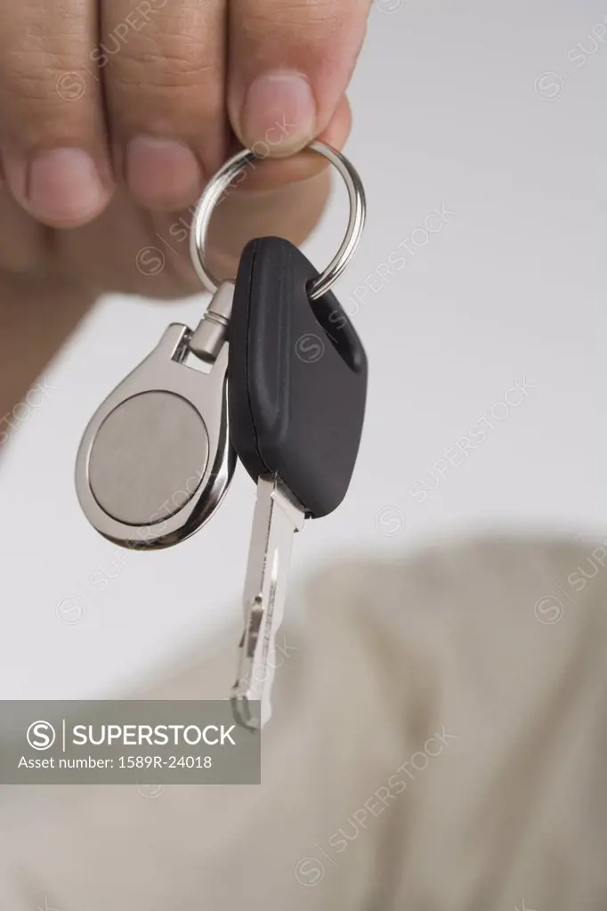 Close up of man's hand holding car key
