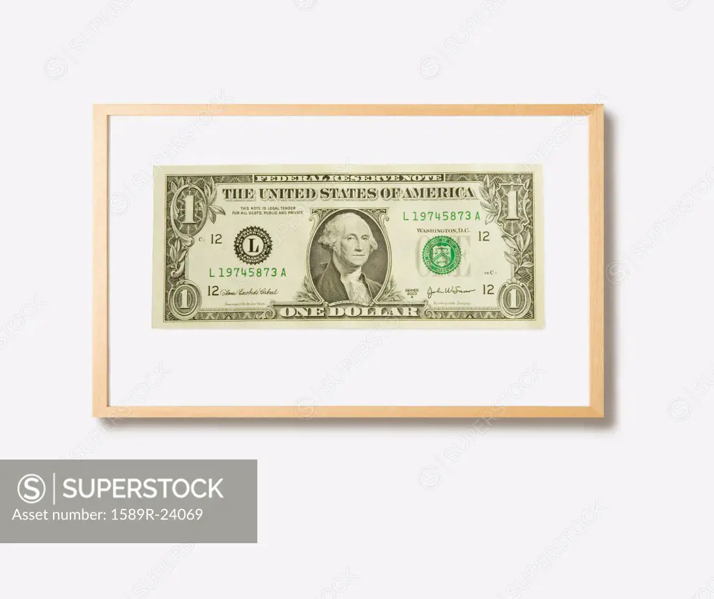 Studio shot of framed dollar bill