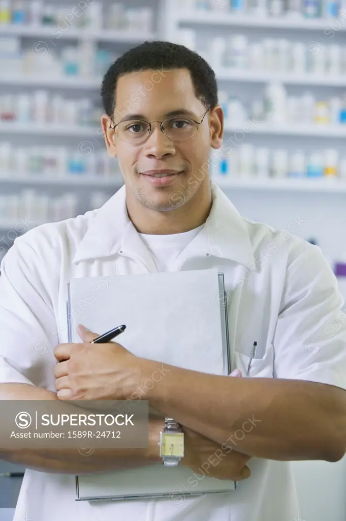 African American male pharmacist with chart