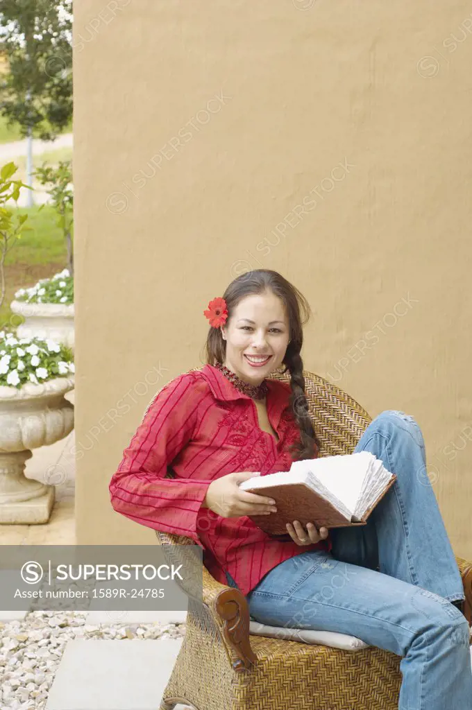 Woman reading book outdoors