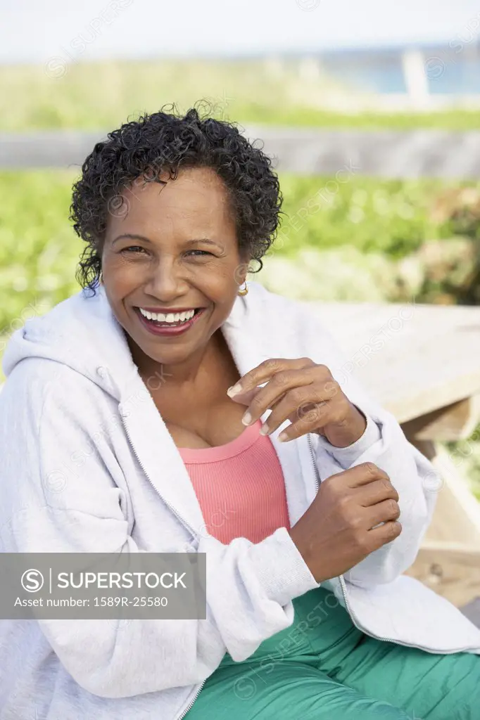 Senior woman laughing outdoors