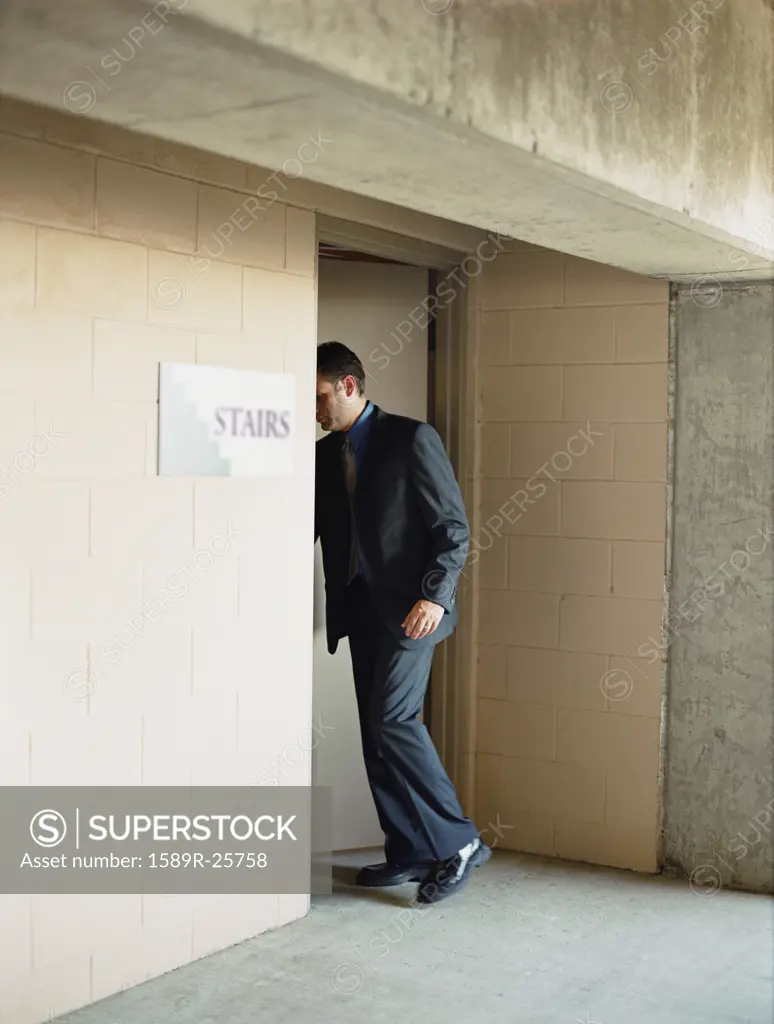 Businessman entering stairs, Dallas, Texas, United States