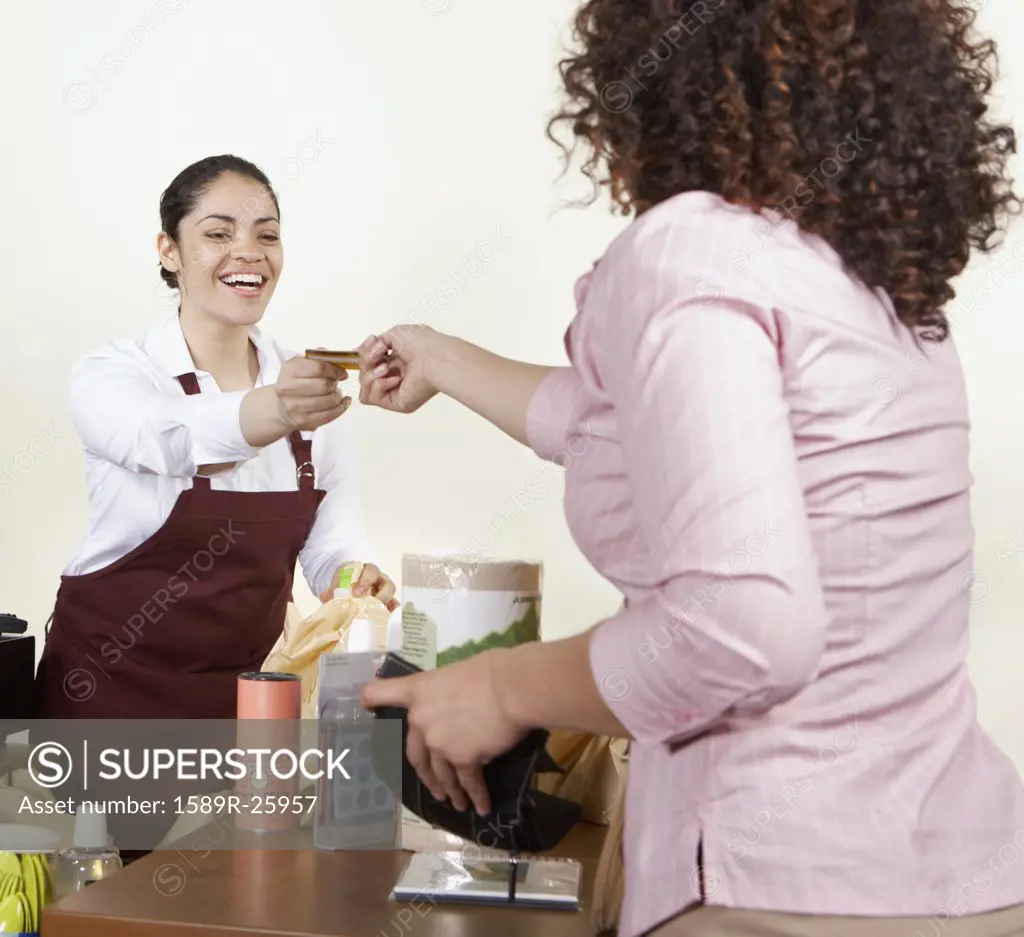 Woman paying for groceries