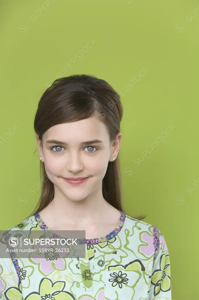 Studio shot of young girl smiling