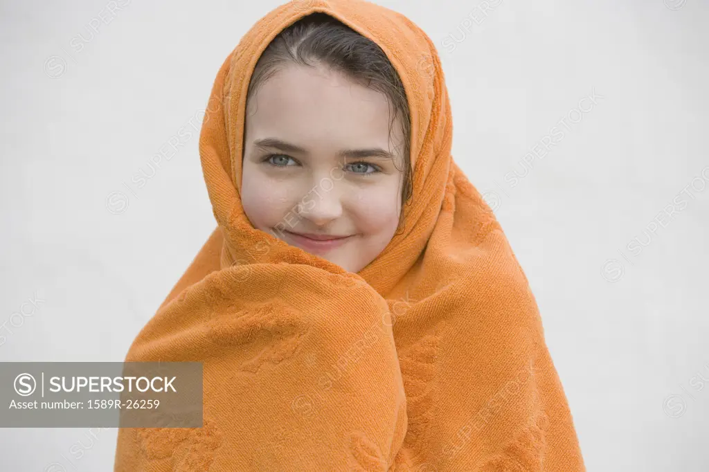 Young girl wrapped in towel
