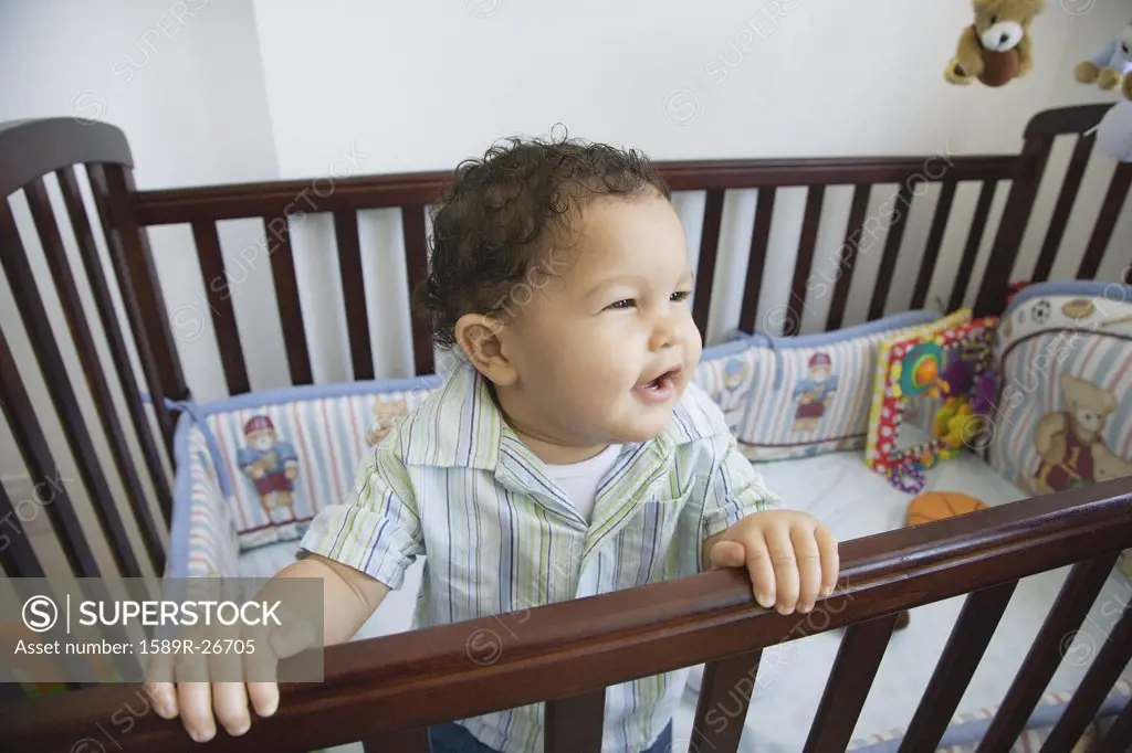 African baby in standing crib