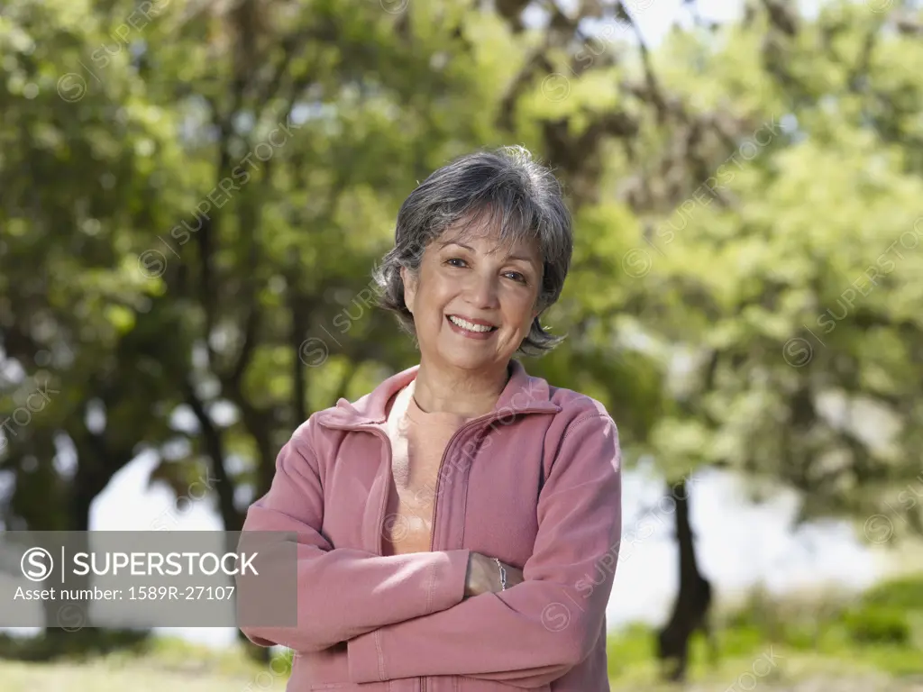 Senior Hispanic woman smiling outdoors
