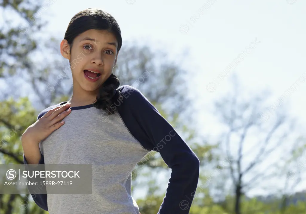 Hispanic girl singing outdoors