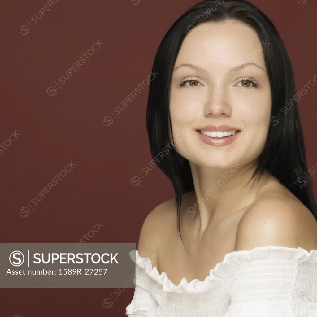 Studio shot of woman smiling