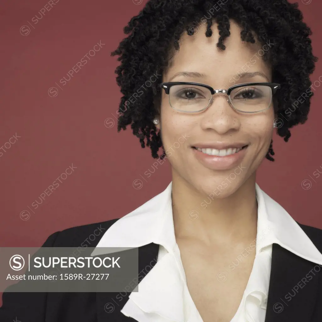 Studio shot of African businesswoman smiling