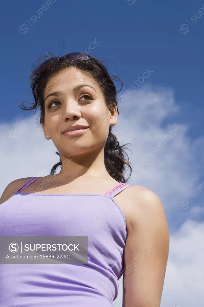 Low angle view of Hispanic woman outdoors