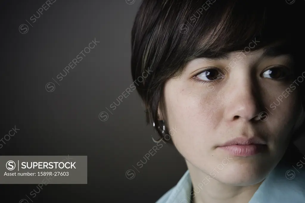 Close up of young woman looking to the side