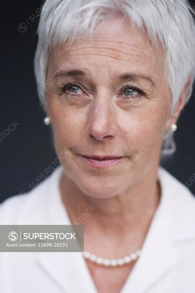 Close up of senior woman looking up 