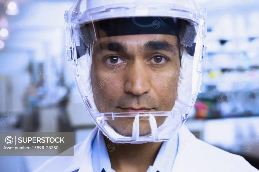Close up of Indian male scientist wearing respirator