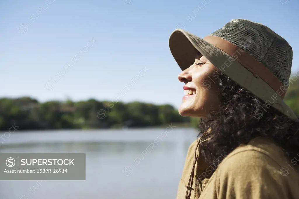 Woman smiling with sun on her face
