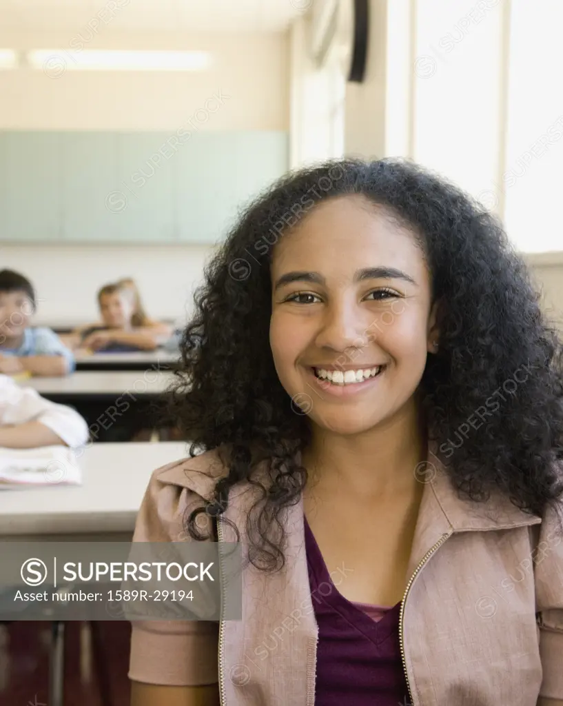 African girl smiling in classroom