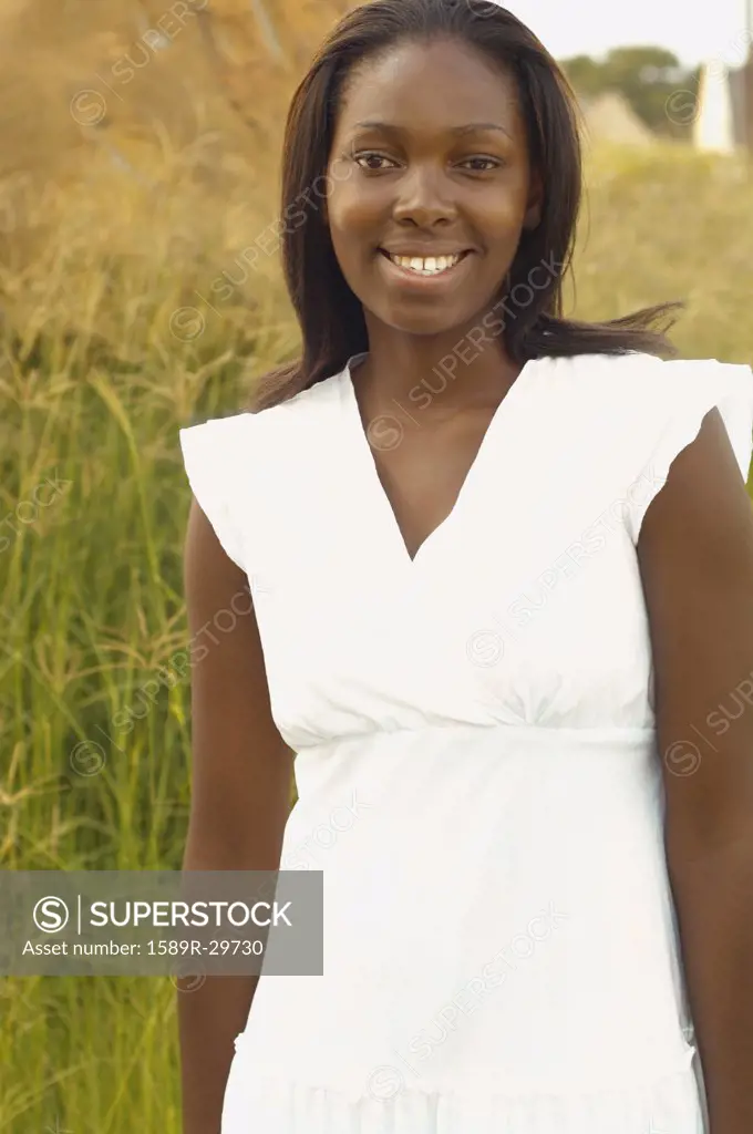 African woman smiling outdoors