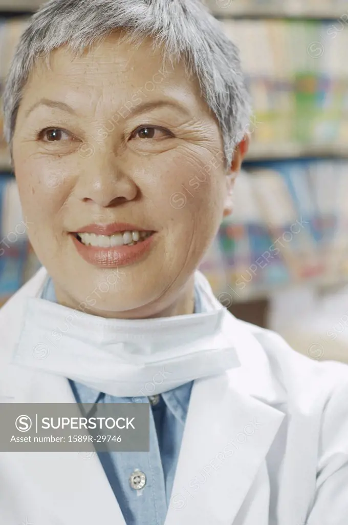 Close up of senior Asian female dentist smiling