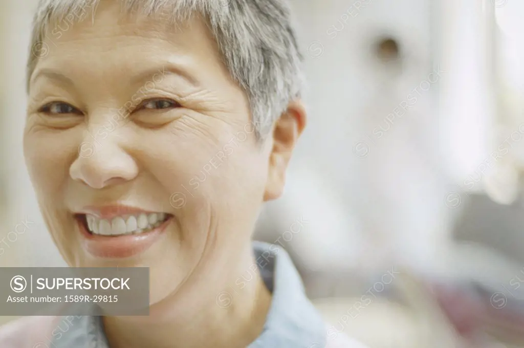Close up of senior Asian woman smiling