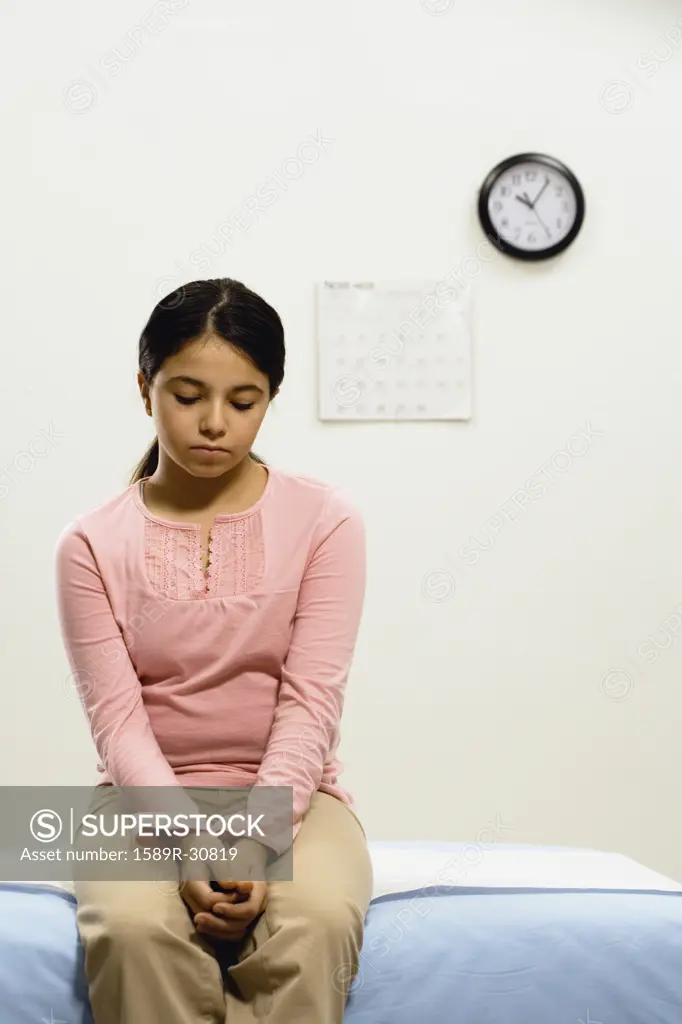 Girl waiting in doctors office