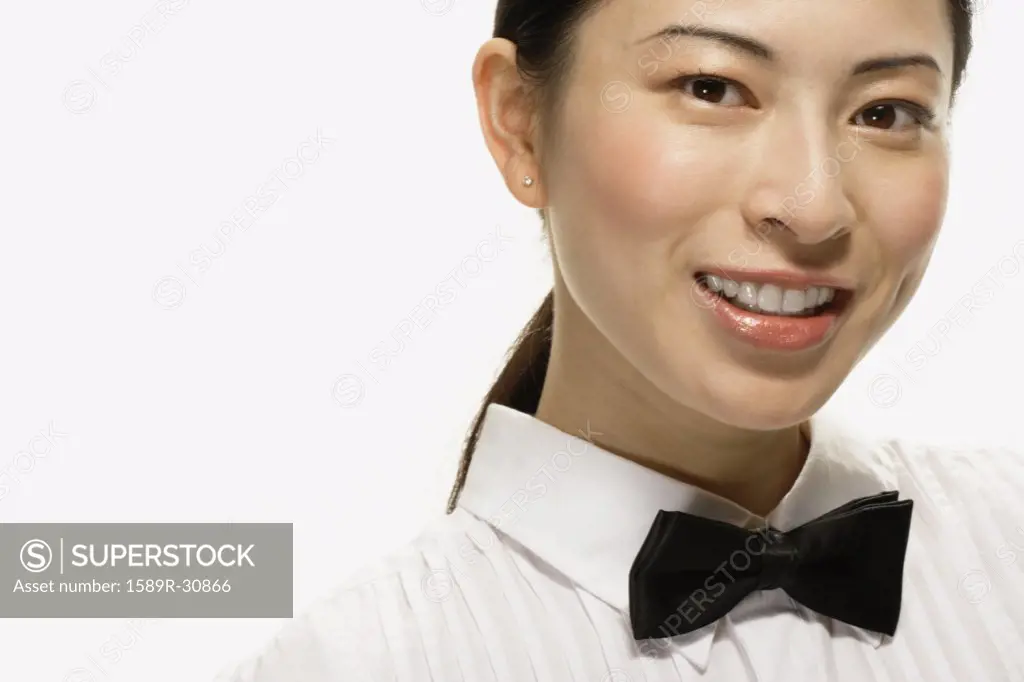 Studio shot of Asian woman smiling