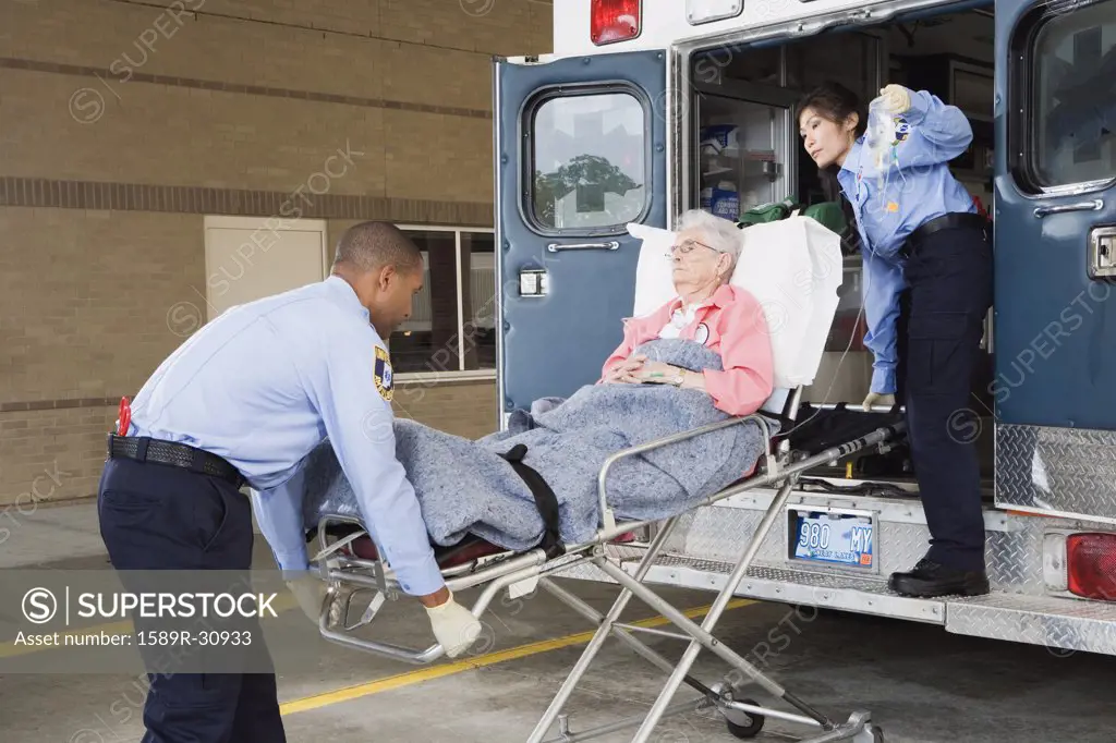 Senior woman being put in ambulance by paramedics