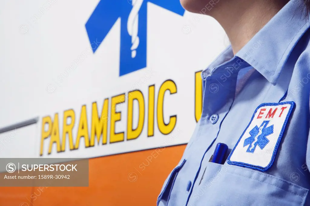 Close up paramedic next to ambulance