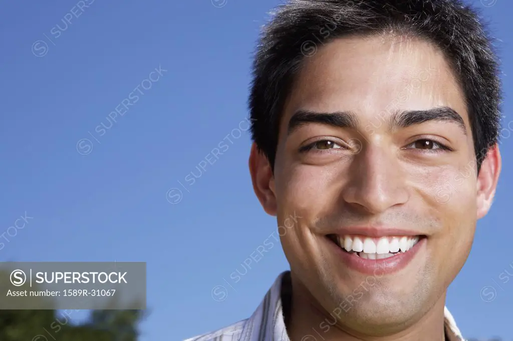 Close up of young man smiling outdoors