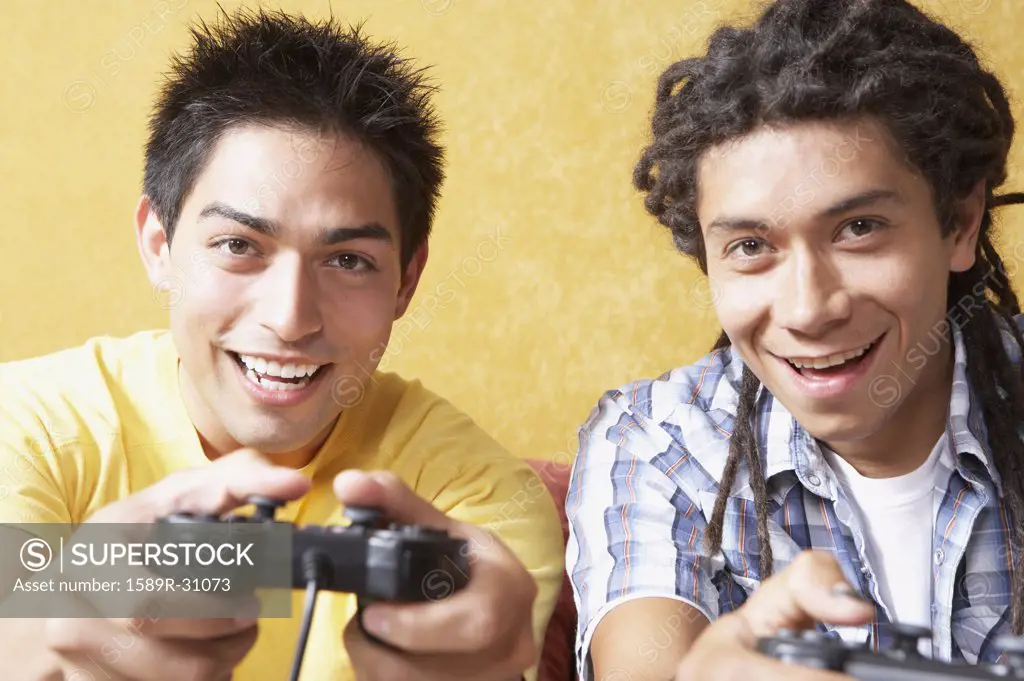 Close up of two young men playing video games