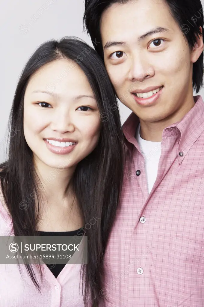 Young Asian couple smiling
