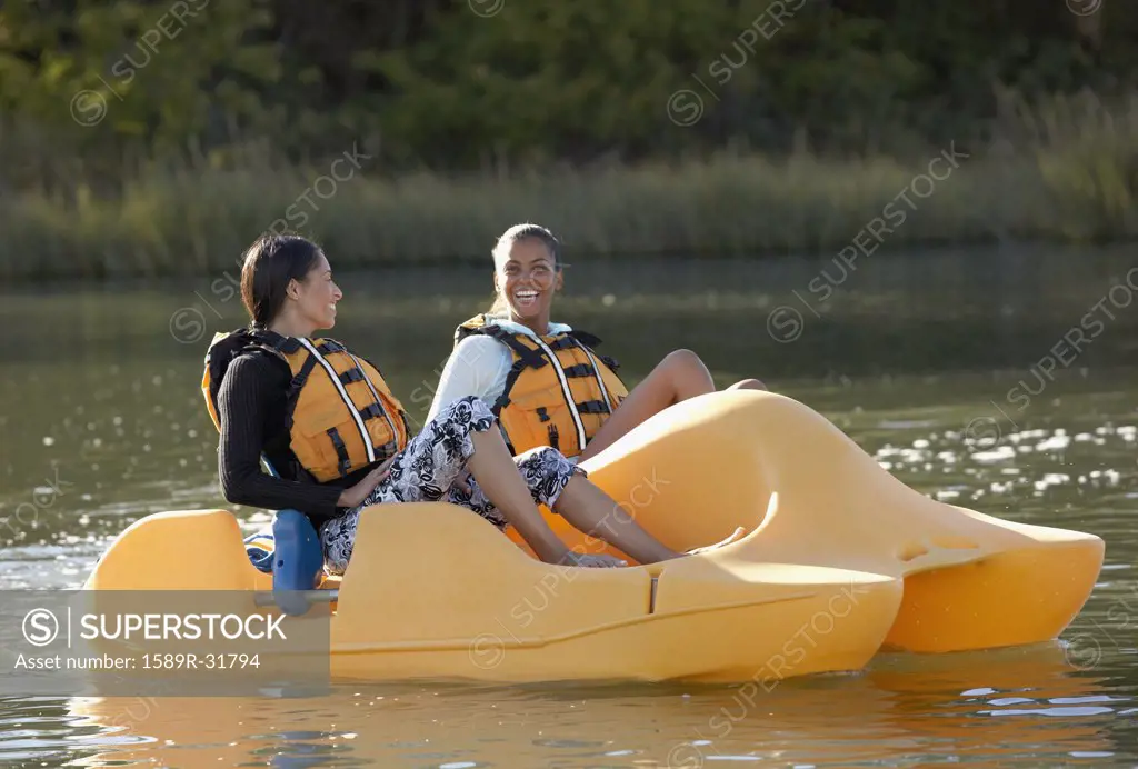 Two African women in paddle boat
