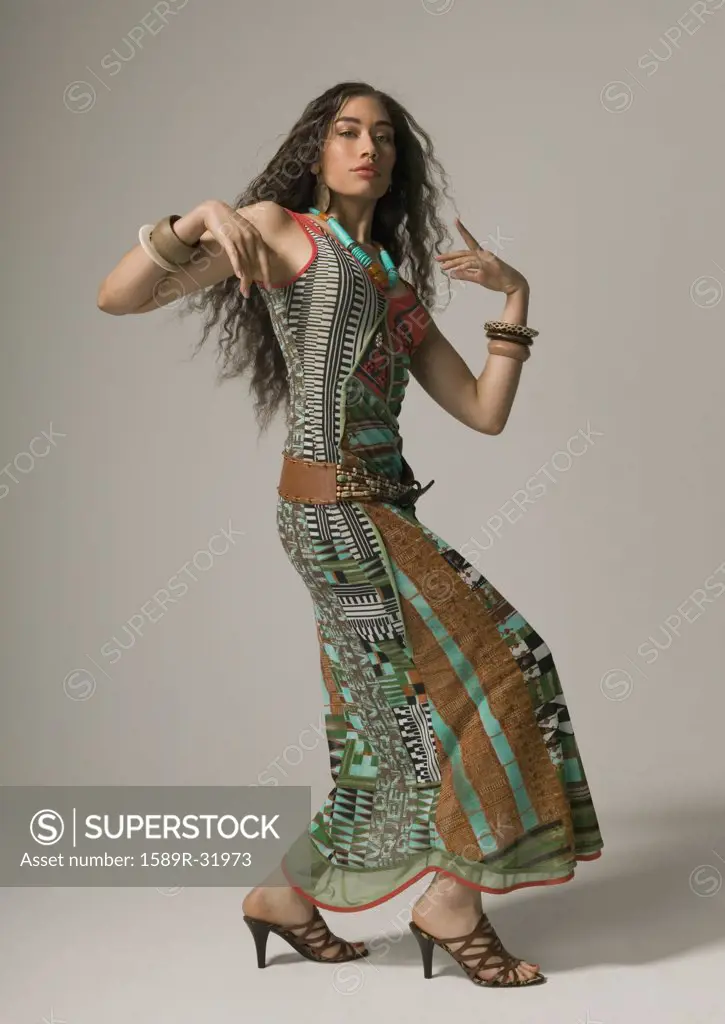 Studio shot of Asian woman dancing
