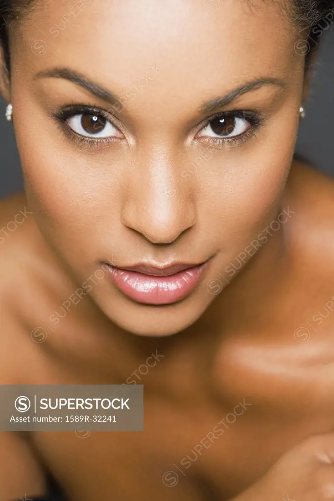 Close up of Hispanic woman with bare shoulders