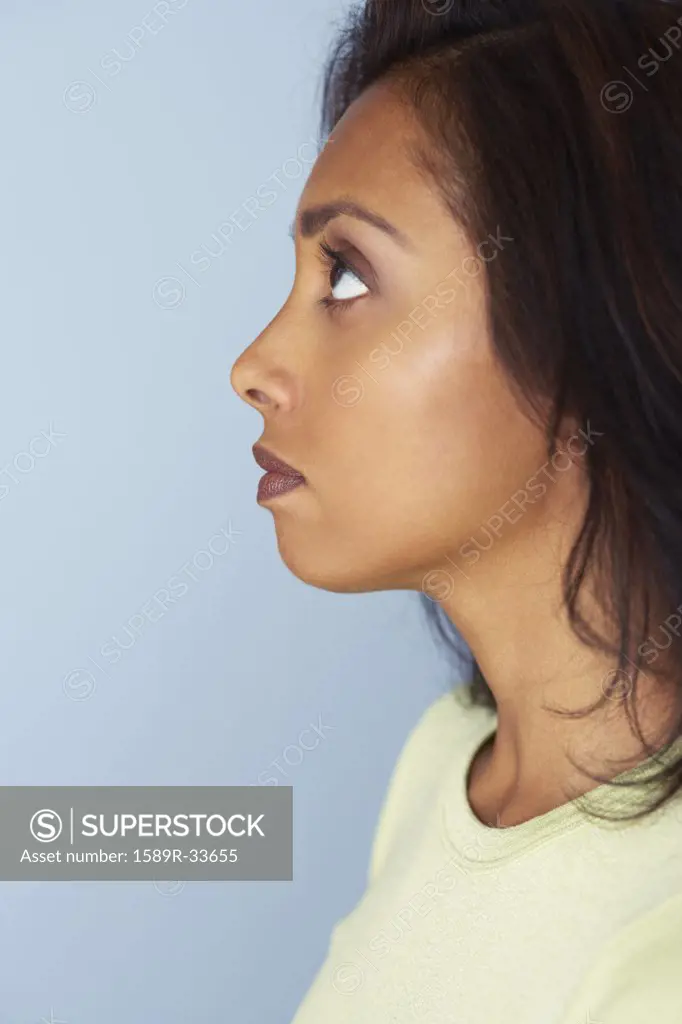 Profile of Asian woman looking up
