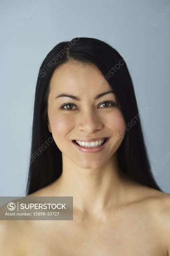 Portrait of Asian woman with bare shoulders