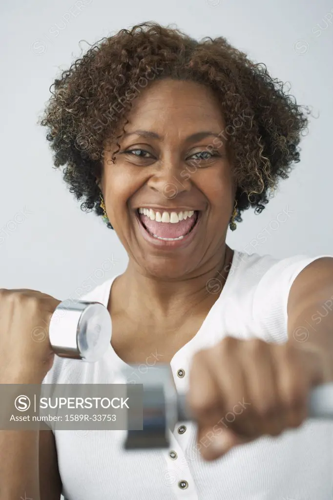 African woman lifting weights