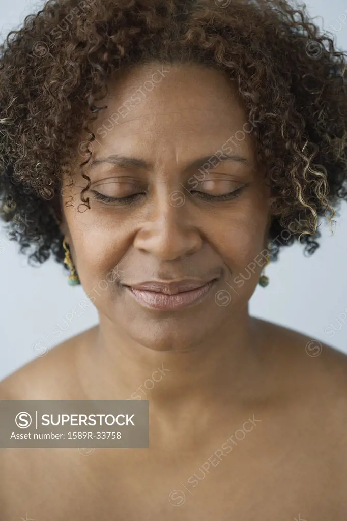 African woman with eyes closed