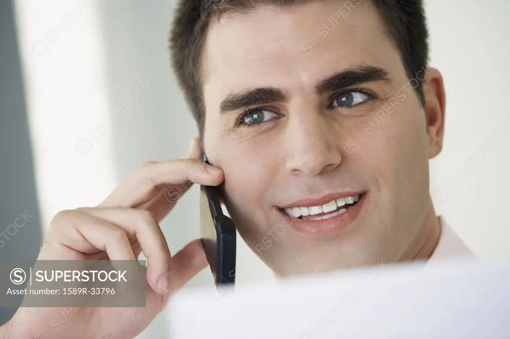 Middle Eastern businessman talking on cell phone