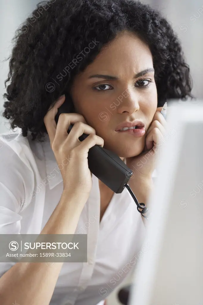 African businesswoman talking on telephone