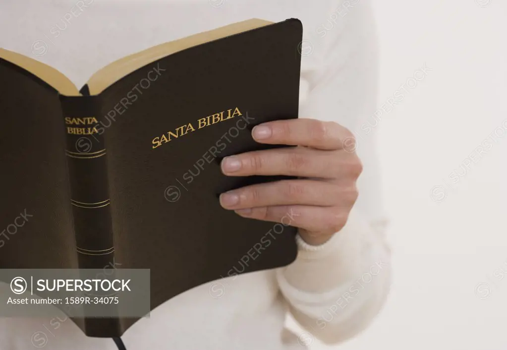 Close up of person reading bible