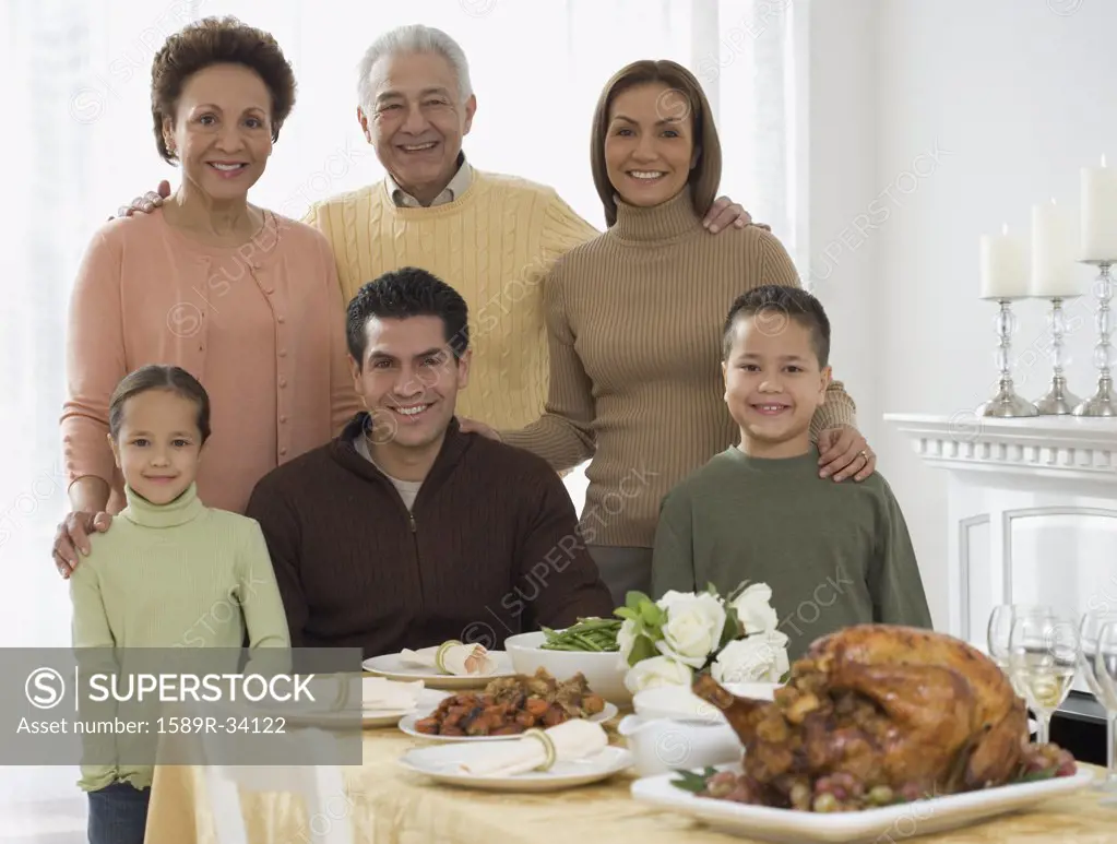 Multi-generational Hispanic family at Thanksgiving table