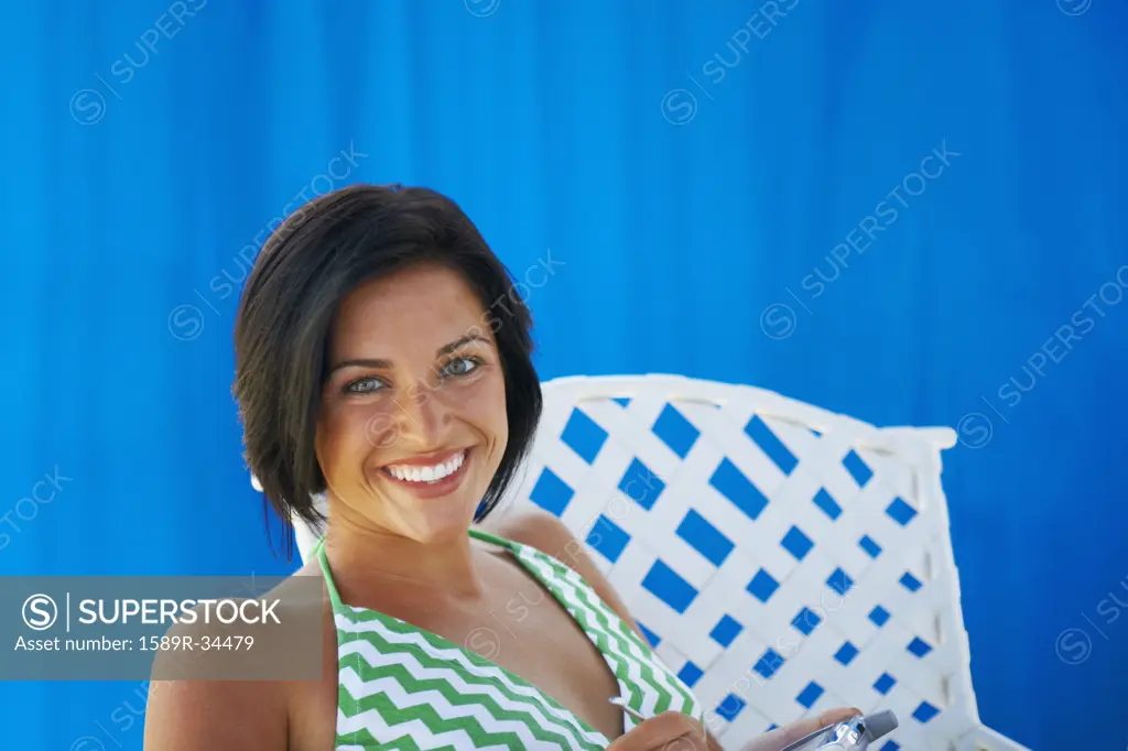 Young woman sitting in chair