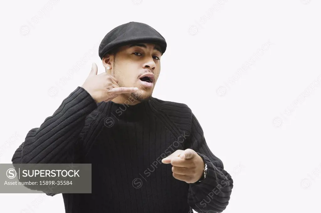 African man making telephone hand gesture and pointing