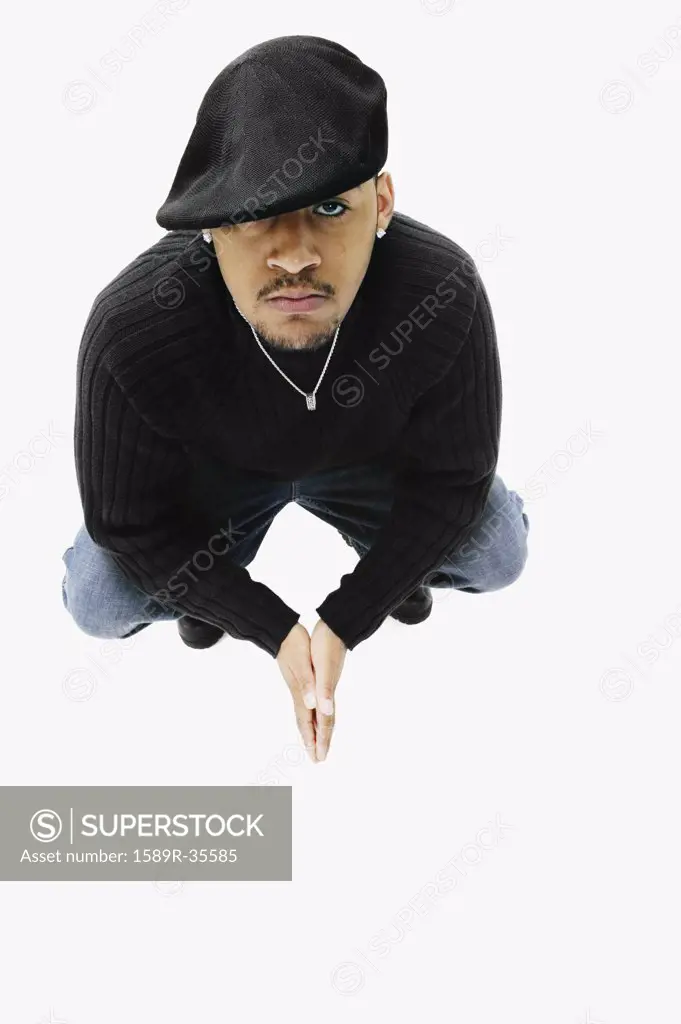 High angle view of African man crouching