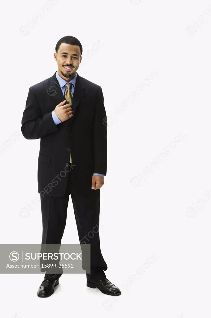 Portrait of African businessman with hand on lapel