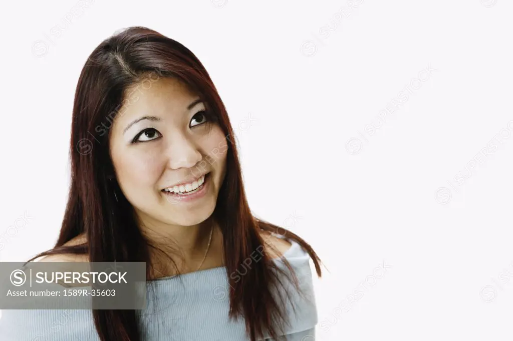 Portrait of Asian woman looking up